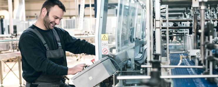 Man working on assembly line controllers